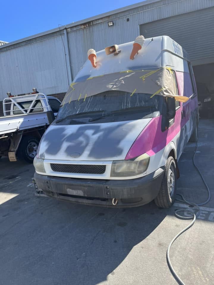 Van with windscreen masked and bonnet sanded ready for repaint